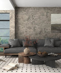 Living room with Extra Thick Concrete Peel And Stick Wallpaper 24 Inch By 354 Inch Light Brown Gray Taupe Self Adhesive Waterproof Vinyl Cement Look For Walls No Fuss Easy Install Bedroom Bathroom Gym Garage 58 Sq Ft Coverage behind a grey sofa and wooden tables.
