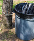 Beefy Heavy Duty 55 Gallon Trash Bags 1.5 Mil Thick Industrial Strength Liners black bag in outdoor trash can