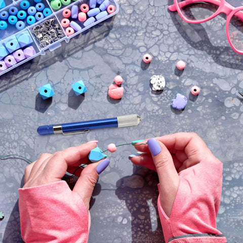 Hands crafting jewelry with beads and tools, illustrating 21-Piece Drill Bit Set With Pin Vise For Jewelry Bead Making And Tiny Wood Carving