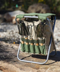 Garden Kneeler And Seat Folding Bench with detachable tote organizer on stone path, olive green with beige accents, tools included