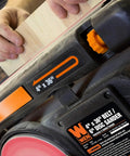 User sanding wood on Two In One Benchtop Belt And Disc Sander For The Home Workshop With Four By Thirty Six Inch Belt And Six By Six Inch Disc Cast Iron Base Belt Tilts Zero To Ninety Degrees 3600 RPM 4.3 Amp Motor Tension Release Lever For Easy Sandpaper Changes