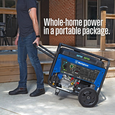 Person moving 12500 Watt Dual Fuel Portable Generator with remote start near a wooden deck, showcasing portability.