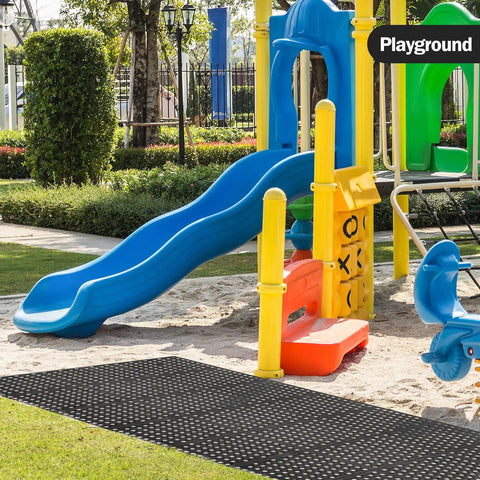 Playground with blue slide next to black Anti Fatigue Drainage Rubber Mat For Wet Areas Non Slip Commercial Kitchen Floor Mat With Holes