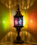 Multi Color Carved Glass Hexagonal Table Lamp With Stained Mosaic Glass And Retro Metal Frame casting colorful glow