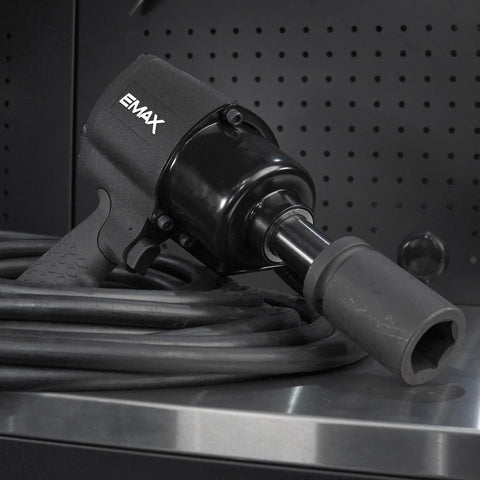 One Inch Drive Air Impact Wrench Packs Ball Bearings And Aluminum Body Pumping Kick Ass Twisting Force Up To 1500 Foot Pounds At 4200 Rpm on workbench.