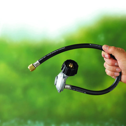 Hand holding 24-inch propane hose and regulator kit for Genesis and Summit gas grills with secure flow control and leak-free hookup.