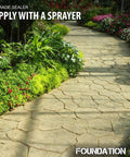 Top Shelf Solvent Based Silane Siloxane Concrete Sealer For Brick Pavers And Natural Stone With Sleek Matte Water Repelling Finish 5 Gallon Drum on a stone path surrounded by colorful flowers.
