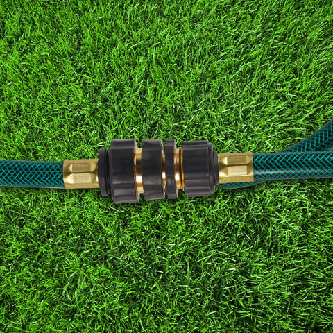 Three Quarter Inch Garden Hose Quick Connectors Kit connecting two hoses, aluminum male and female quick connect fittings, on grass