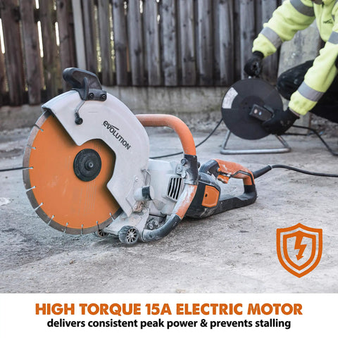 R12DCT 12 Inch Concrete Saw With Water Fed Dust Suppression For Masonry Electric No Gas Four And One Half Inch Cut Depth Adjustable Blade Guard Includes Premium Diamond Blade Workhorse Heavy Duty Dust Control shown on the ground with orange blade and electric cord