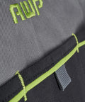 Close-up of stitching and logo on durable 13 inch tool bag with water resistant exterior for pros and contractors.