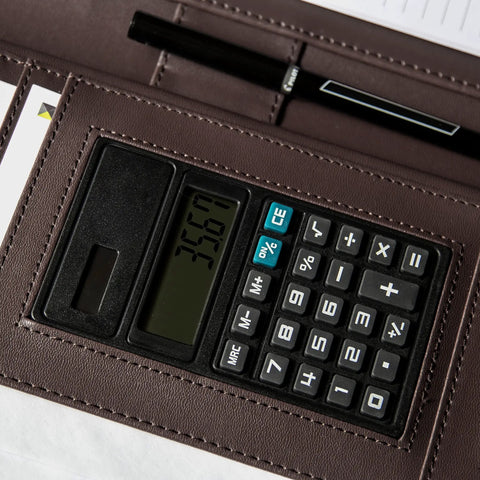 Career Game Changer Business Padfolio With Heavy Duty Zipper Closure Crafted From Smooth Pu Vegan Leather Featuring A Roomy 101 Inch Tablet Sleeve Built In Solar Calculator And Clever Desk Organizer For Bosses In Rich Brown showing solar calculator detail.