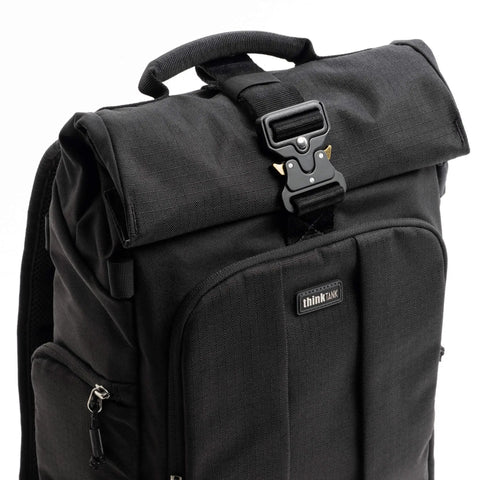Close-up of Roll Top 30L Camera Backpack With Laptop Sleeve And Rain Cover Asphalt Black showing buckle detail and design.