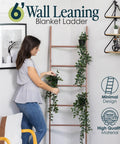 Woman arranging plants on a 5 Foot 8 Inch Blanket Ladder For Living Room And Bedroom With 6 Tiers Wall Leaning Laminate No Snag Construction