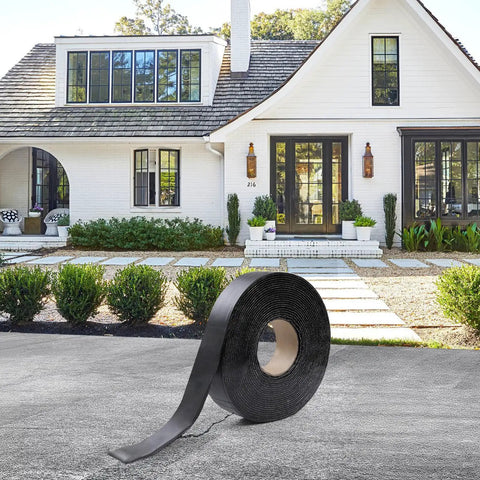 Self Adhering Asphalt Crack Tape 1.57 Inch By 50 Feet No Torch Required Easy Fix For Driveways Parking Lots Roofs And Roads 3mm Thick Durable Joint Repair Tape For Cracks And Gaps in front of a house