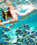 Person snorkeling underwater with Beast Mode Rechargeable LED Spotlight Flashlight With Pistol Grip Waterproof Submersible Floats