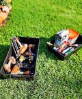 Stackable Plastic Storage Bins And Totes Modular Storage System 2.5 Cu Ft Organizing Containers For Home Garage And Office USA Made Durable Weatherproof Pack Of 2 with tools on grass