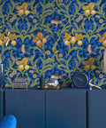 Vintage Bird Peel and Stick Wallpaper in Blue Floral Pattern on wall behind blue cabinet.