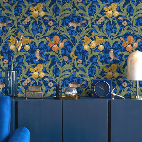 Vintage Bird Peel and Stick Wallpaper in Blue Floral Pattern on wall behind blue cabinet.