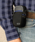 Black Weatherproof Compact Camera Case With Padded Interior And Accessory Pockets worn on a belt