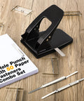 Heavy Duty Two Hole Punch Workhorse with 50 Prong Fasteners, padded grip handle, 30 sheet capacity, on wooden desk with fasteners