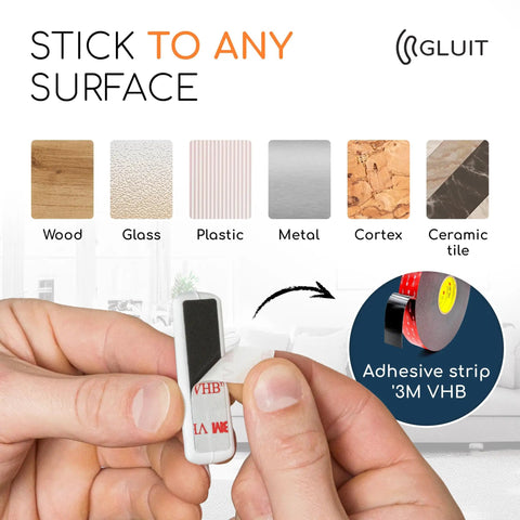 Close-up of adhesive strip being applied for Five Pack Cable Organizers For Desk And Nightstand With Adhesive Clips Fifteen Slots White