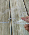 Four In One Acrylic Router Template Kit For Charcuterie Boards And Woodworking, clear puzzle piece template in hand.