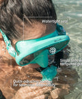 Person in water wearing Musa Frameless Dive Mask With Low Internal Volume And Wide Field Of View In Aqua Green.
