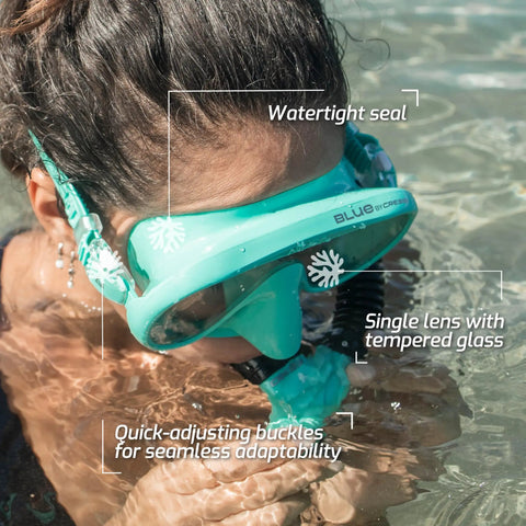 Person in water wearing Musa Frameless Dive Mask With Low Internal Volume And Wide Field Of View In Aqua Green.