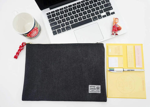 Heavy Duty Canvas Document Organizer Portfolio Featuring Secure Ykk Zipper and Built Tough Construction on office desk with laptop.