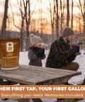 Slick Maple Syrup Tapping Kit With Ten Heavy Duty Spiles Precision Drill Bit And Three Foot Tubing Drops for beginners, featuring a man drilling into a tree.