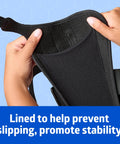 Hands holding Slip On Wrist And Forearm Splints for Right Arm, Medium, 10 Inch, showing inner lining and hook and loop straps