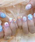 Hand showing nail art with cartoon designs using Gel Palette For Nail Art Non Wipe Painting Gel Set With 40 Colors In Individual Squares