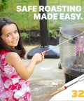 Child using 32 Inch Smores Skewers 5 Pack For Campfire Marshmallow Roasting Stainless Steel Roasting Forks by a bonfire.