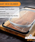 6-Quart Over The Sink Stainless Steel Colander With Expandable Rubber Handles on a wooden surface