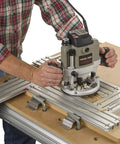 Person using Dead On Heavy Duty Adjustable Variable Router Jig Kit 18X32 Inch for precise woodworking cuts.