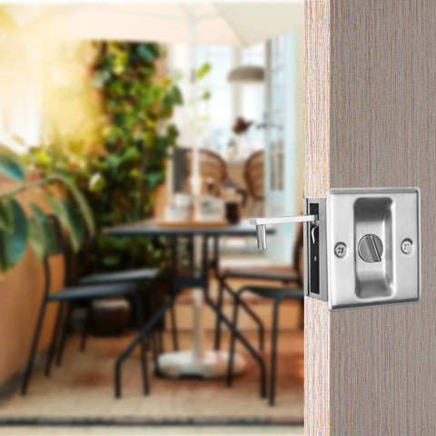 Slick Brushed Nickel Pocket Sliding Door Lock And Privacy Pull Handle With Reversible Latch Hardware Kit For Smooth Glide And No Sweat Setup On Interior Doors Sized One Three Eighths Inch Thick, installed in wood door.
