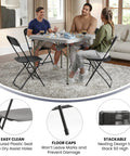 Hercules Set Of 10 Indoor Outdoor Heavy Duty Plastic Folding Chairs, 650 Lb Static Weight Capacity, shown in living room setting.