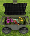 Rolling Garden Cart With Seat For Planting And Weeding Plastic Storage Bench And Interior Tool Tray in green on grass