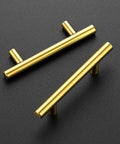 Two brushed brass cabinet pulls, stainless steel, 5-inch, on a dark background, part of Brushed Brass Cabinet Pulls Set 60 Pack 5 Inch Stainless Steel Kitchen Drawer Handles 3 Inch Center To Center Durable Hardware For Cabinets Easy Install Modern Look.
