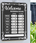 Two Pack Changeable Business Hours Signs For Doors And Windows With Six Time Stickers In Durable Black PVC Measuring 13.78 By 9.45 Inches