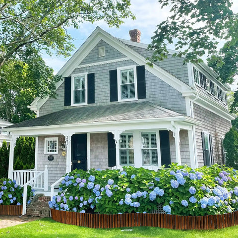 Wooden Garden Edging Border With Burnt Wood Finish Flexible No Dig Landscape Border in front of house with hydrangeas