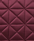 Close-up of Premium Satin Luxe Air Tec Quilted Dressage Saddle Pad texture in burgundy with diamond quilting pattern.