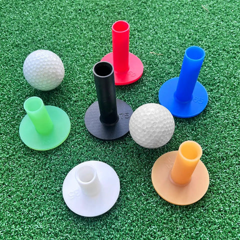 Rubber Golf Tees Set With Six Colors And Six Sizes For Indoor And Outdoor Practice, displayed on turf with golf balls