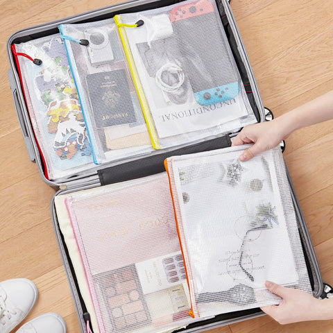 Colorful A4 Zipper Mesh Document Pouches 24 Pack Set In 10 Colors Waterproof Storage Bags in suitcase for travel use with documents.