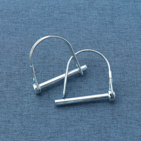 Beefy Heavy Duty Trailer Coupler Pin Pack Of 4 Zinc Plated Carbon Steel Hitch Pin Safety Locking Pins One Quarter Inch By Two Point Sixteen Inches Rust Resistant And Ready For Real World Towing. Close-up view of two pins on textured surface.