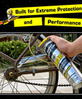 Applying All-In-One Multi-Purpose Lubricant Spray For Rusted Bolts, Tools, Bikes And Garden Gear on bike chain close-up.