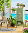 Heavy Duty Outdoor Storage Cabinet In Sage Green With Waterproof Rust Resistant Steel Construction on a patio with plants and chair