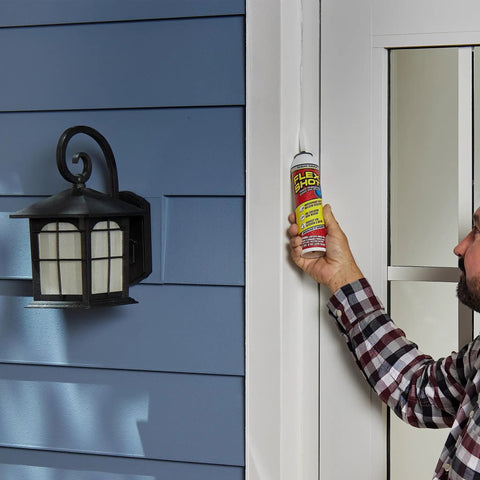 Person applying Flexible Silicone Sealant Caulk For DIY Friendly Wet Area Sealing, Waterproof And UV Resistant, No Caulk Gun Needed on exterior door frame.