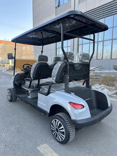 Heavy Duty Four Seater Electric Golf Cart With Premium Luxury Seats And Badass Off Road Tires Straight Fire Backyard Cruiser with LED display, rear view.