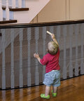 Toddler near stair banister with Stair Banister Guard Netting Kit For Kids And Pets 2 Pack 18 Ft By 2.6 Ft Mesh Safety Net